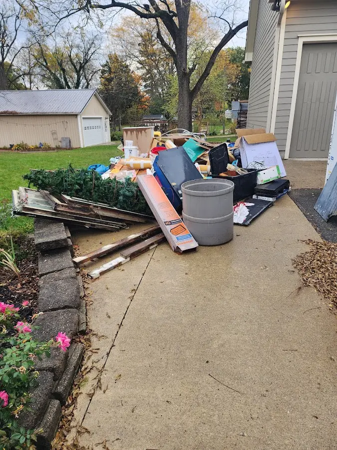 Dumpster being loaded with debris for Demolition Dumpster Rental in Augusta